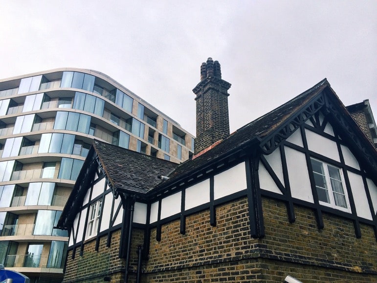 You don't get much closer than this - the modern Cheval Residences Three Quays behind one of the historic buildings of the Tower of London