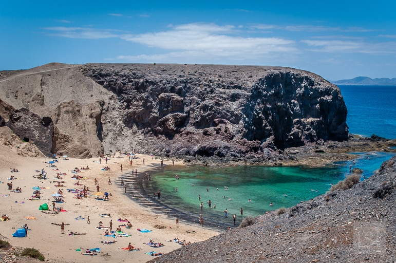 Places to go at Christmas - warm up on one of the Canary Island's beaches like Playa de Papagayo, in Lanzarote